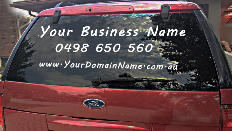White vinyl lettering on vehicle rear window