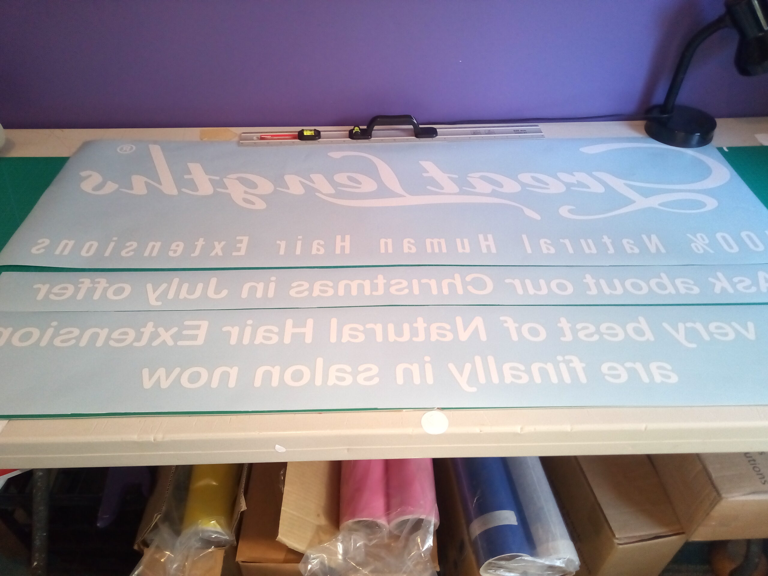 Custom vinyl text prepared for application